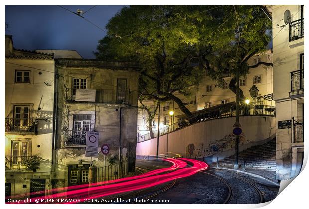 The Rua do Salvador street and light tails at nigh Print by RUBEN RAMOS