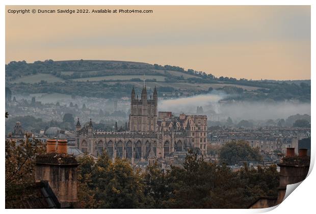 Moody early morning mist rising behind Bath Abbey Print by Duncan Savidge