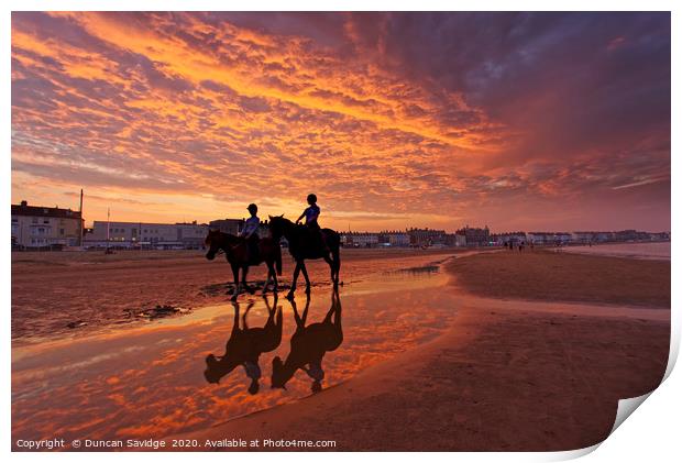 Fiery  sunset on weymouth beach horses Print by Duncan Savidge