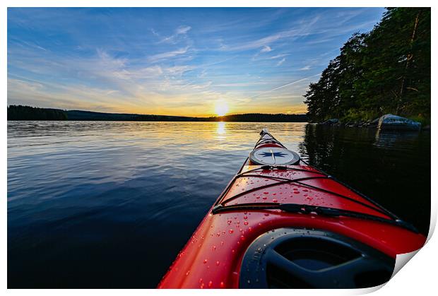 red plastic kayak on calm water in the sunset Print by Jonas Rönnbro