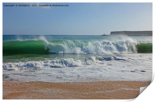 Waves crashing onto a sandy beach in the algarve Print by Rocklights 