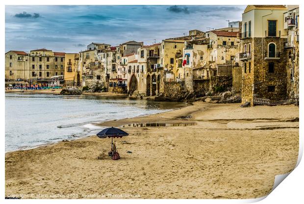 Beach with umbrella in the city of cefalu Print by Mario Koufios