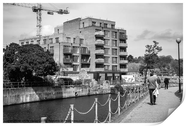 Flats under construction on the bank of the River Wensum, Norwich Print by Chris Yaxley