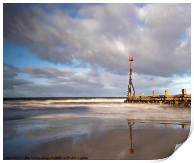 Long exposure image of wooden sea breakers, Cromer Print by Chris Yaxley