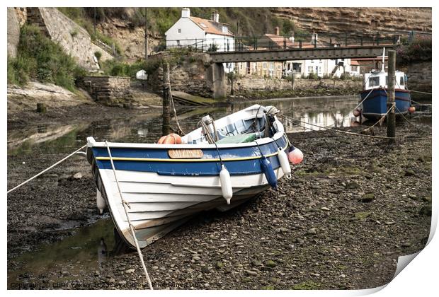 Fishing boat in the seaside village of Staithes Print by Chris Yaxley