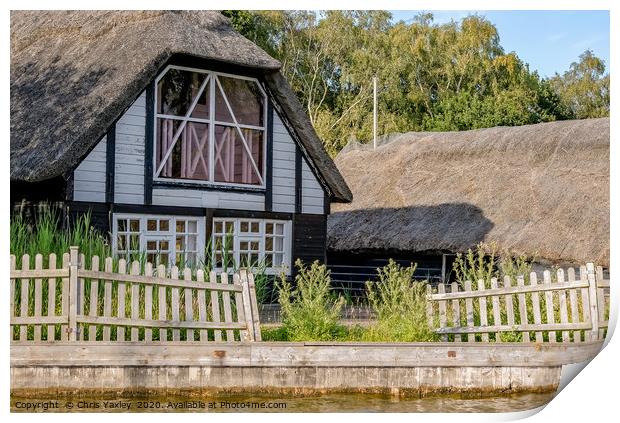 Traditional riverside cottage with thatched roof Print by Chris Yaxley