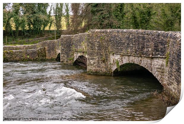 Sheepwash Bridge over a raging River Wye in Ashford in the Water, Derbyshire Print by Chris Yaxley