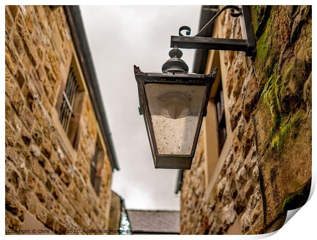 Victorian style light on an old and historic building in a narrow alley way Print by Chris Yaxley
