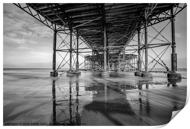 Beneath the boardwalk of Cromer pier Print by Chris Yaxley