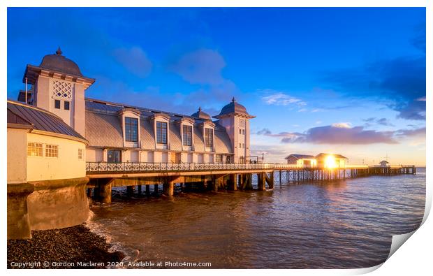 Winter sunrise reflecting off Penarth Pier Print by Gordon Maclaren