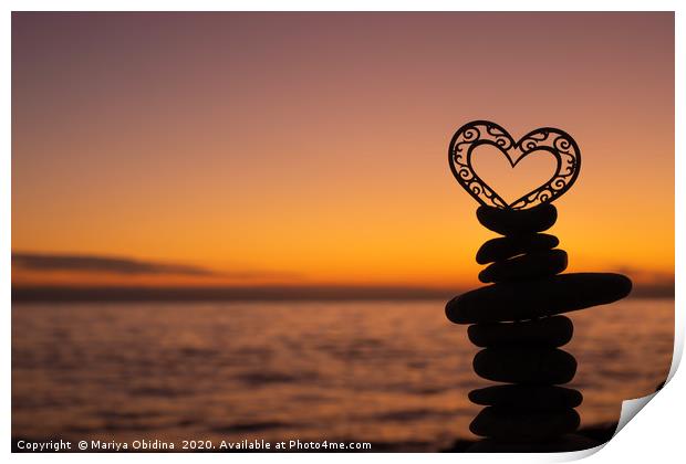 Heart on stones on the beach at sunset. Print by Mariya Obidina