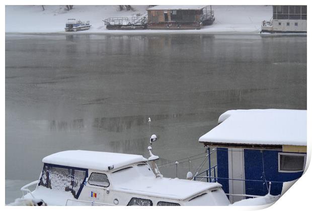 Boats under the snow on the river Borcea Print by liviu iordache