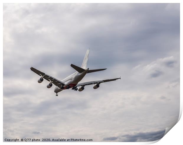 Passenger plane flying in the blue sky with clouds Print by Q77 photo