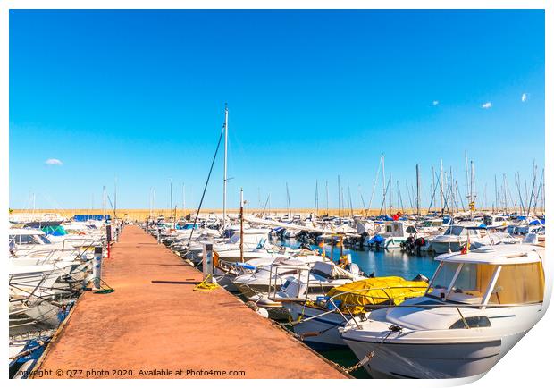 Beautiful luxury yachts and motor boats anchored in the harbor, hot summer day and blue water in the marina, blue sky Print by Q77 photo