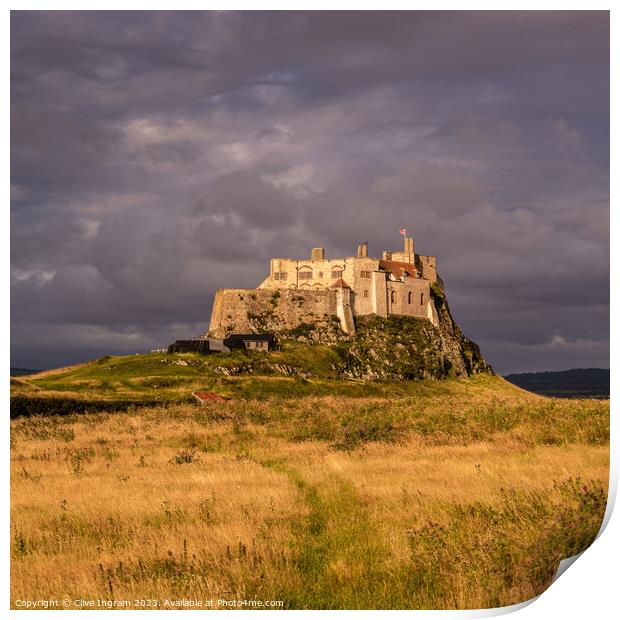 Storm clouds over Lindisfarne Castle Print by Clive Ingram
