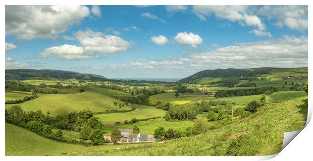 Dappled sunlight across the Vale of Porlock Print by Shaun Davey