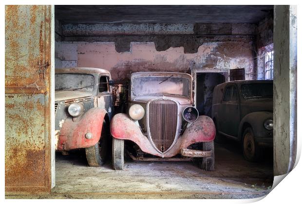 Abandoned Vintage Cars in Garage Print by Roman Robroek
