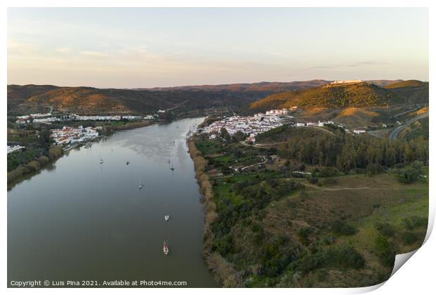 Aerial drone view of Sanlucar de Guadiana in Spain and Alcoutim in Portugal with sail boats on Guadiana river Print by Luis Pina