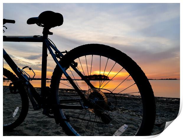 Bike silhouette and sunrise light on beach Print by Miro V