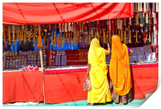 Couple of unidentified women in traditional hindu wear saree buying or shopping jewelery items in the commercial street of Pushkar fair in state of Rajasthan, India. Colorful Indian culture concept Print by Arpan Bhatia