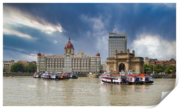 Mumbai, India: Wide angle shot of Gateway of India and Taj hotel against sea and dramatic cloudy sky Print by Arpan Bhatia