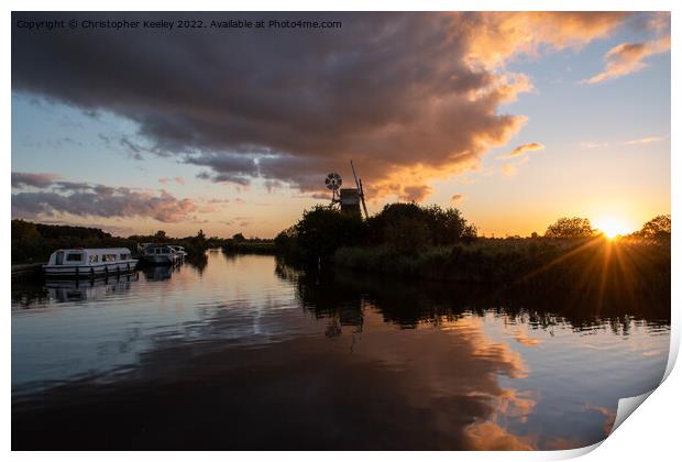 Sunset at Norfolk Broads windmill Print by Christopher Keeley