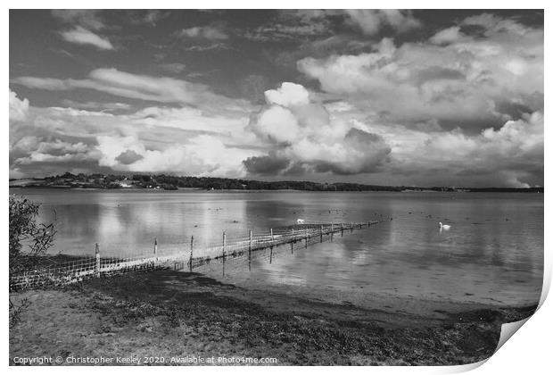Cloudy skies over Rutland Water Print by Christopher Keeley