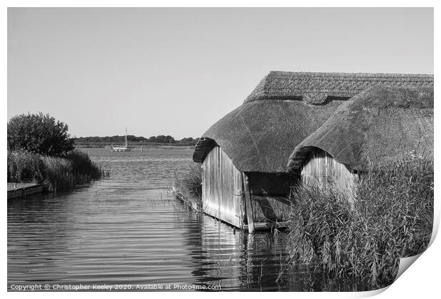 Hickling boathouses  Print by Christopher Keeley