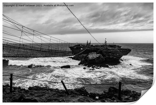 Swinging rope foot bridge to a rock island Print by Hanif Setiawan