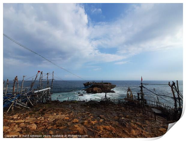 A rock plateau and a rock island in the sea Print by Hanif Setiawan