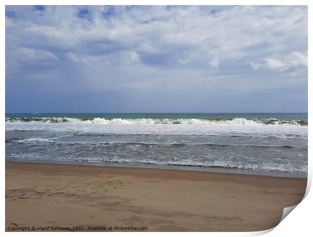 Sand beach wavy sea and cloud sky 1a Print by Hanif Setiawan