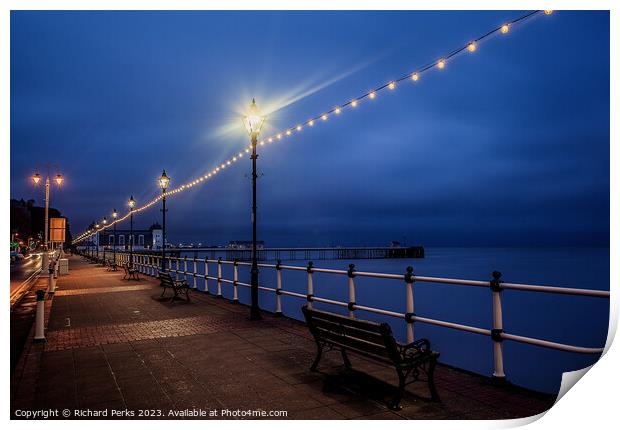Evening lights on Penarth Promenade Print by Richard Perks