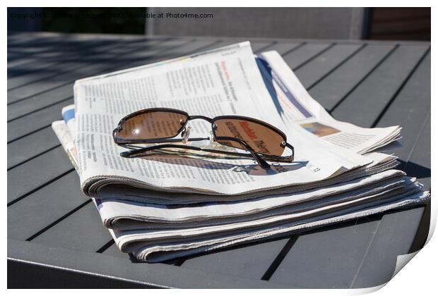 Pile of newspapers and sunglasses Print by aurélie le moigne