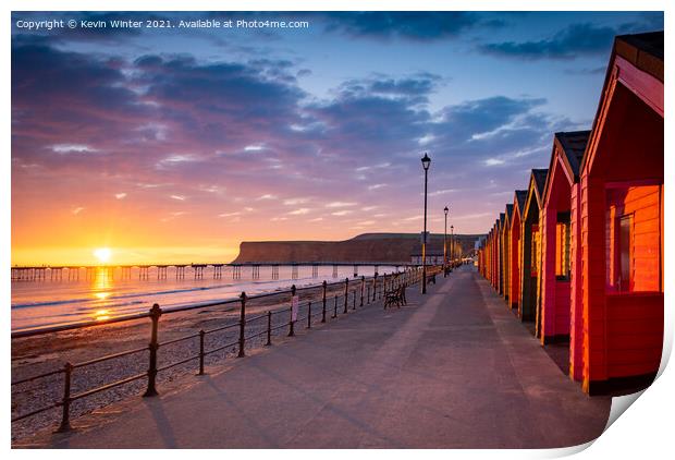 Beach huts at sunrise Print by Kevin Winter