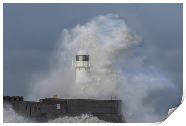 Lighthouse battered by stormy seas Print by Kevin Winter