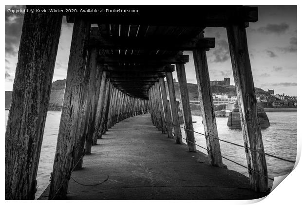 Under the East pier Print by Kevin Winter