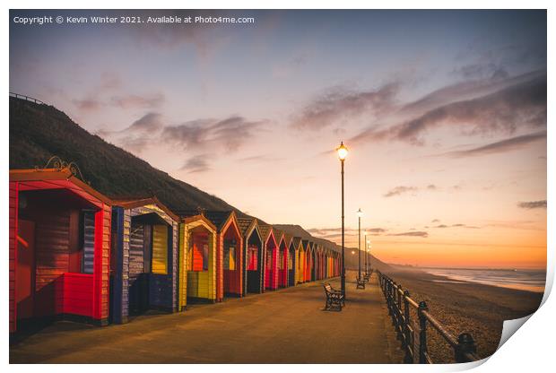 Beach Huts at sunset Print by Kevin Winter