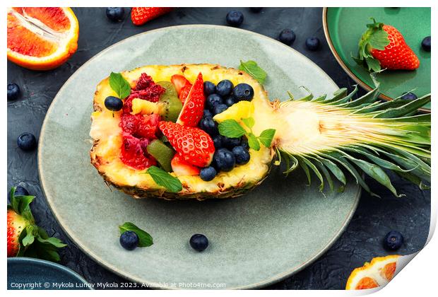 Fruit salad in half a pineapple, vegan concept. Print by Mykola Lunov Mykola