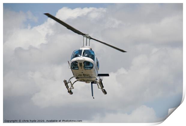 helicopter under cumulous clouds Print by chris hyde