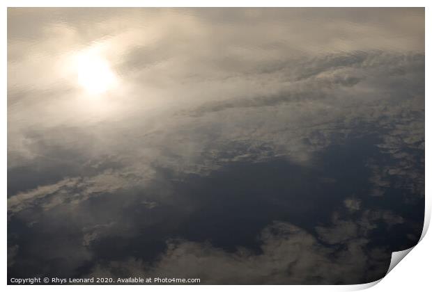 Reflection of evening sun and clouds in still redmires reservoir water. Print by Rhys Leonard