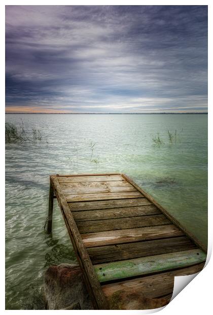 Wooden pier in lake Balaton of Hungary in a cloudy Print by Arpad Radoczy