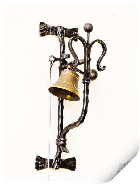 A vertical shot of a bell hung on the forged metal isolated on white background Print by Ingo Menhard
