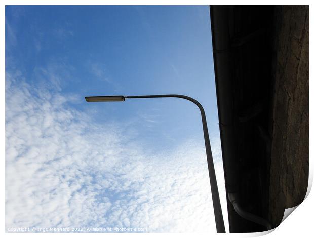 A low angle shot of a street light on a cloudy sky background Print by Ingo Menhard