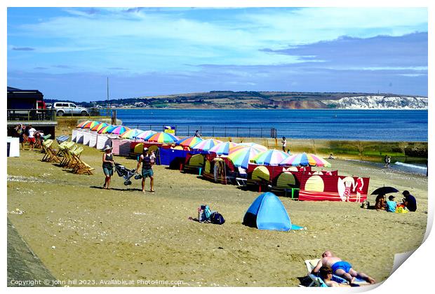 Vibrant Umbrellas Adorning Shanklin Seashore Print by john hill