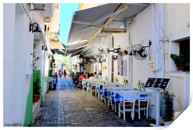 Food and drink in a back alley of Skiathos town in Greece.   e Print by john hill