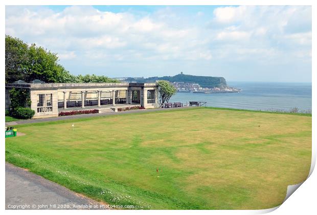 Shelter and putting green with the town in the background at Scarborough in Yorkshire Print by john hill