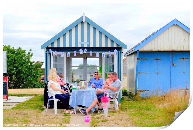 Beach hut tea party on the promenade at Sutton on Sea in Lincolnshire. Print by john hill