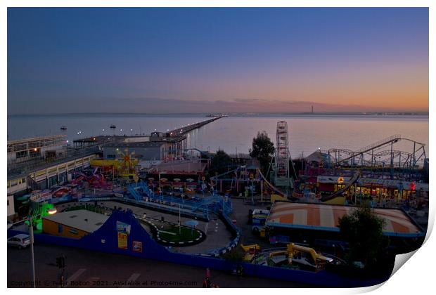 Evening view of the seafront at Southend on Sea showing 'Adventure Island' and the pier. Print by Peter Bolton