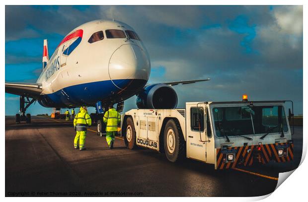 787 dreamliner and tow team Print by Peter Thomas