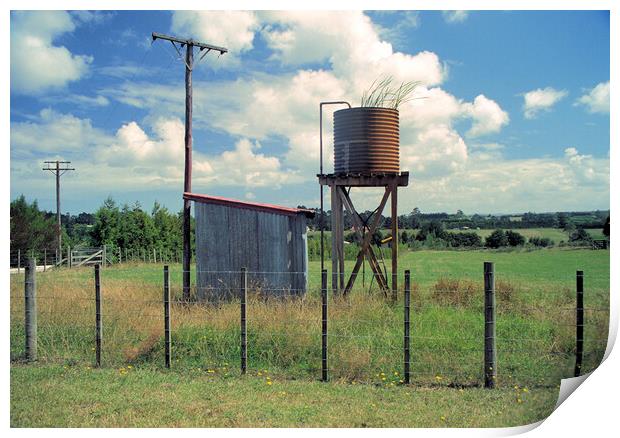 Unused water tank in the countryside in New Zealand Print by Kevin Plunkett